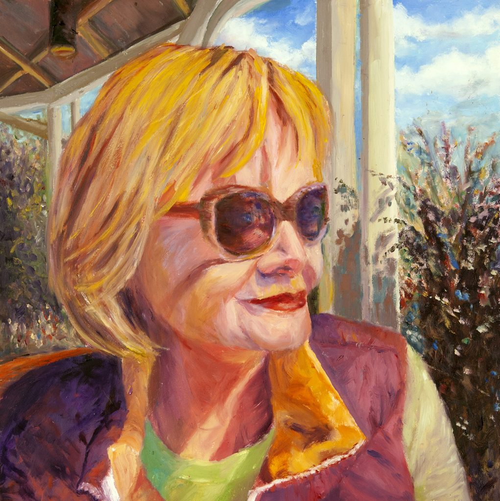 melissa pinney, artist self portrait sitting outside with the sun on her face